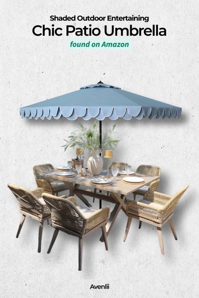 Blue scalloped patio umbrella shading an outdoor dining table with wicker chairs and table decor, creating a stylish backyard entertaining setup.